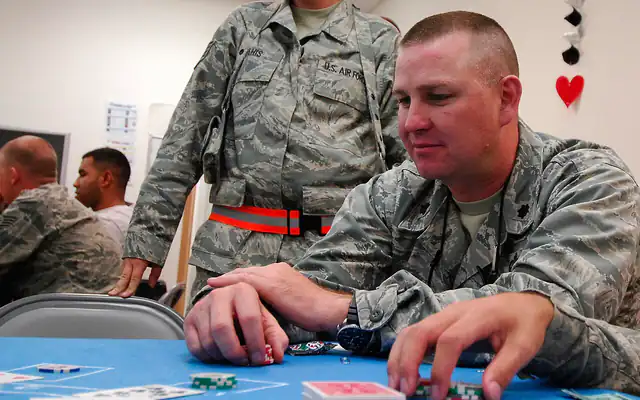 Player stacking chips at a card table during a casino night event